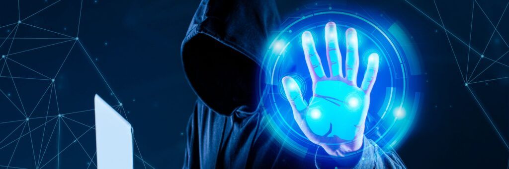 Pessoa com capuz e holograma de mão digital azul